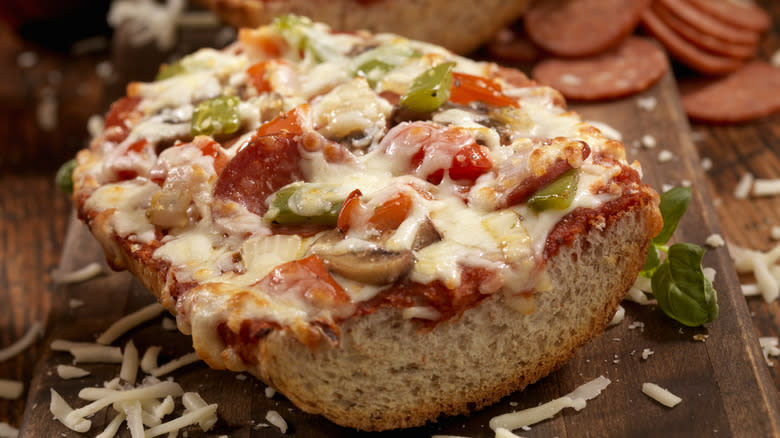 French bread pizza on cutting board