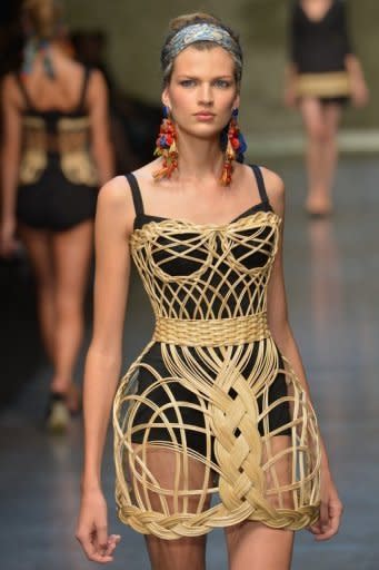 Models walk the runway at the Dolce & Gabbana show on September 23 during Milan fashion week. Worn under netting or over black underwear, the corsets put a modern spin on an antique femininity, recasting the Sicilian noblewoman for the 21st century