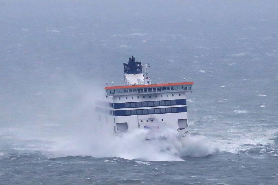 A ferry arrives at the Port of Dover in Kent as bad weather causes ferry delays. (PA)