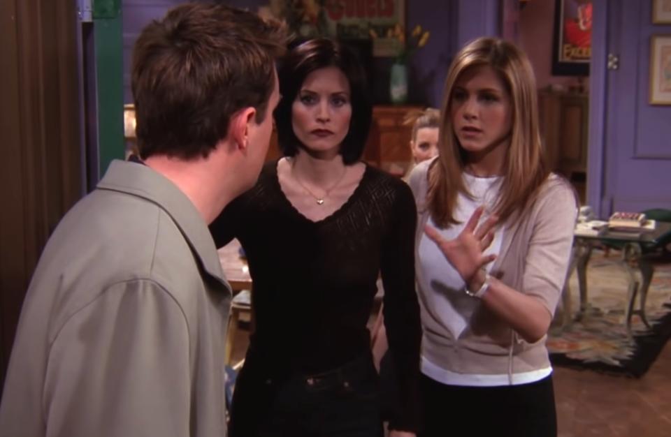 Rachel and Monica answering the door of their apartment in "Friends"