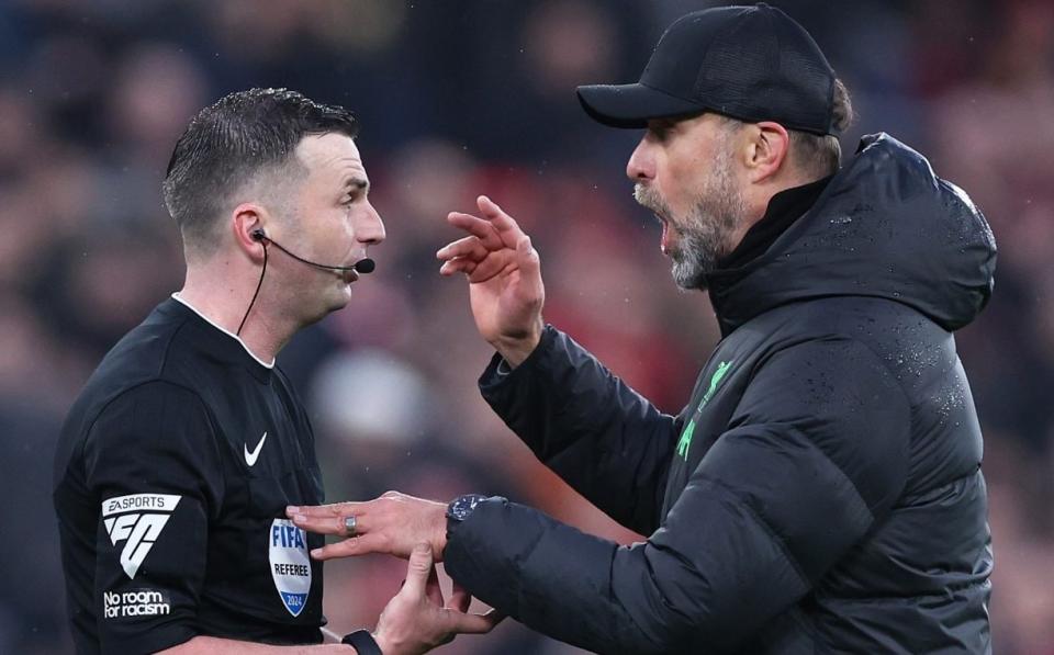 Jürgen Klopp confronts referee Michael Oliver at the final whistle of the match.