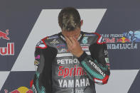 Yamaha rider Fabio Quartararo of France reacts on the podium after winning the MotoGP race during the Andalucia Motorcycle Grand Prix at the Angel Nieto racetrack in Jerez de la Frontera, Spain, Sunday July 26, 2020. (AP Photo/David Clares)