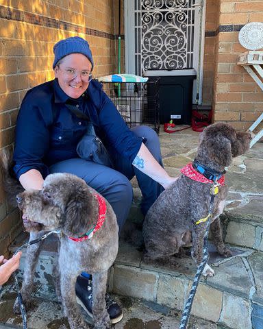 <p>Hannah Gadsby Instagram</p> Hannah Gadsby poses with their two dogs.