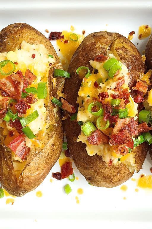 <p>We're still drooling over these stuffed spuds.</p><p>Get the <a href="https://www.delish.com/uk/cooking/recipes/a29531370/loaded-baked-potatoes-bacon-cheddar-recipe/" rel="nofollow noopener" target="_blank" data-ylk="slk:Loaded Baked Potatoes;elm:context_link;itc:0;sec:content-canvas" class="link ">Loaded Baked Potatoes</a> recipe.</p>