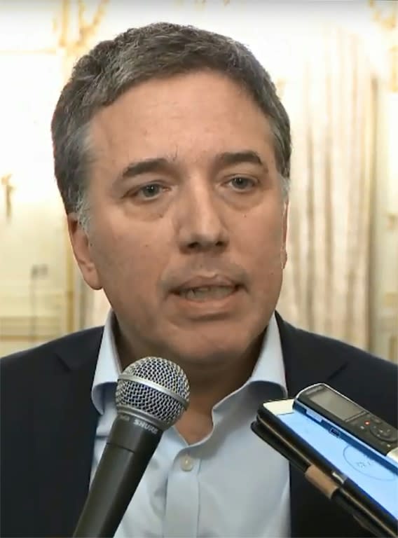 A screengrab taken from a handout video released by Argentina's Presidency showing Argentina's Economy Minister Nicolas Dujovne talking to reporters at the Casa Rosada presidential palace in Buenos Aires