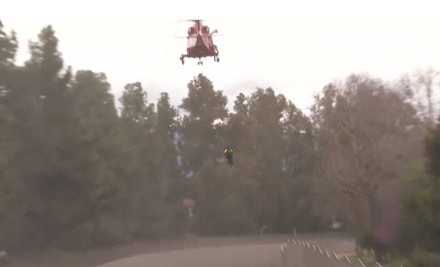 Firefighters rescue woman from storm-flooded L.A. River