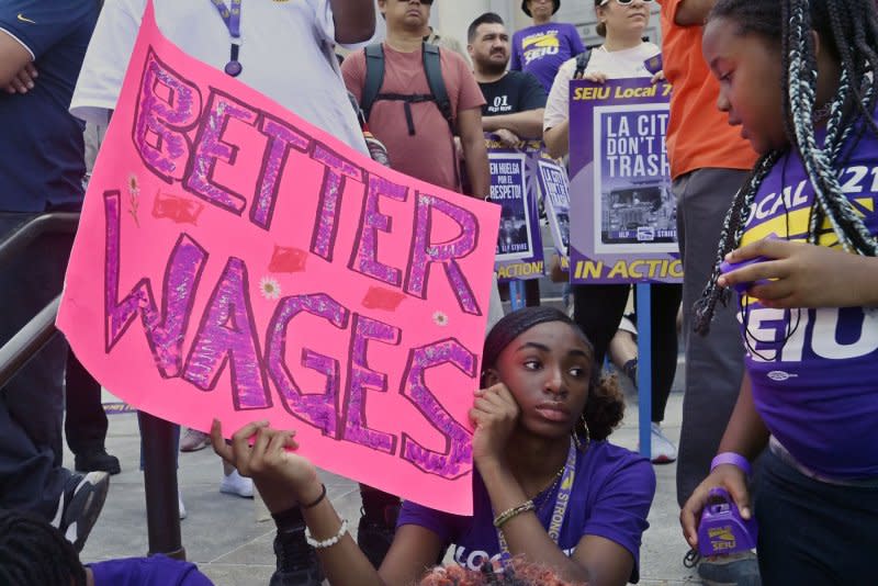 Los Angeles city workers rally at City Hall on Tuesday as thousands went on strike for a scheduled 24-hour work stoppage prompted by what their union believes is a lack of good-faith labor negotiations. Photo by Jim Ruymen/UPI