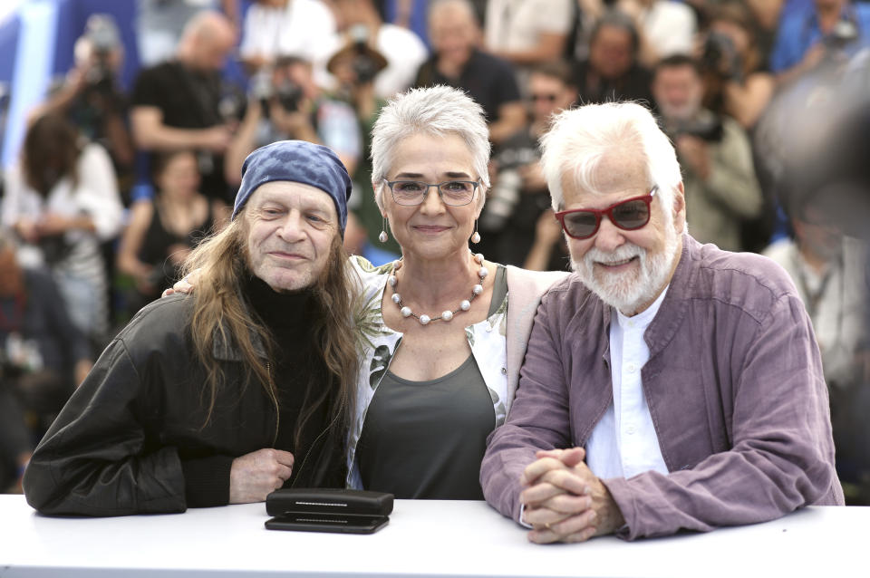 Actor Leon Vitali, from left, Katharina Kubrick and producer Jan Harlan pose for photographers at the photo call for the film 'The Shining' at the 72nd international film festival, Cannes, southern France, Thursday, May 16, 2019. (AP Photo/Petros Giannakouris)