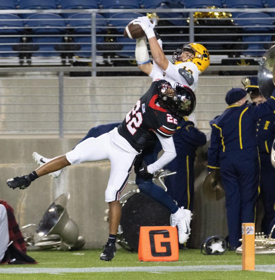 St. Ignatius’s Cody Haddad makes a third-quarter touchdown reception over McKinley’s Geno Kelly, Friday, Nov. 3, 2023.