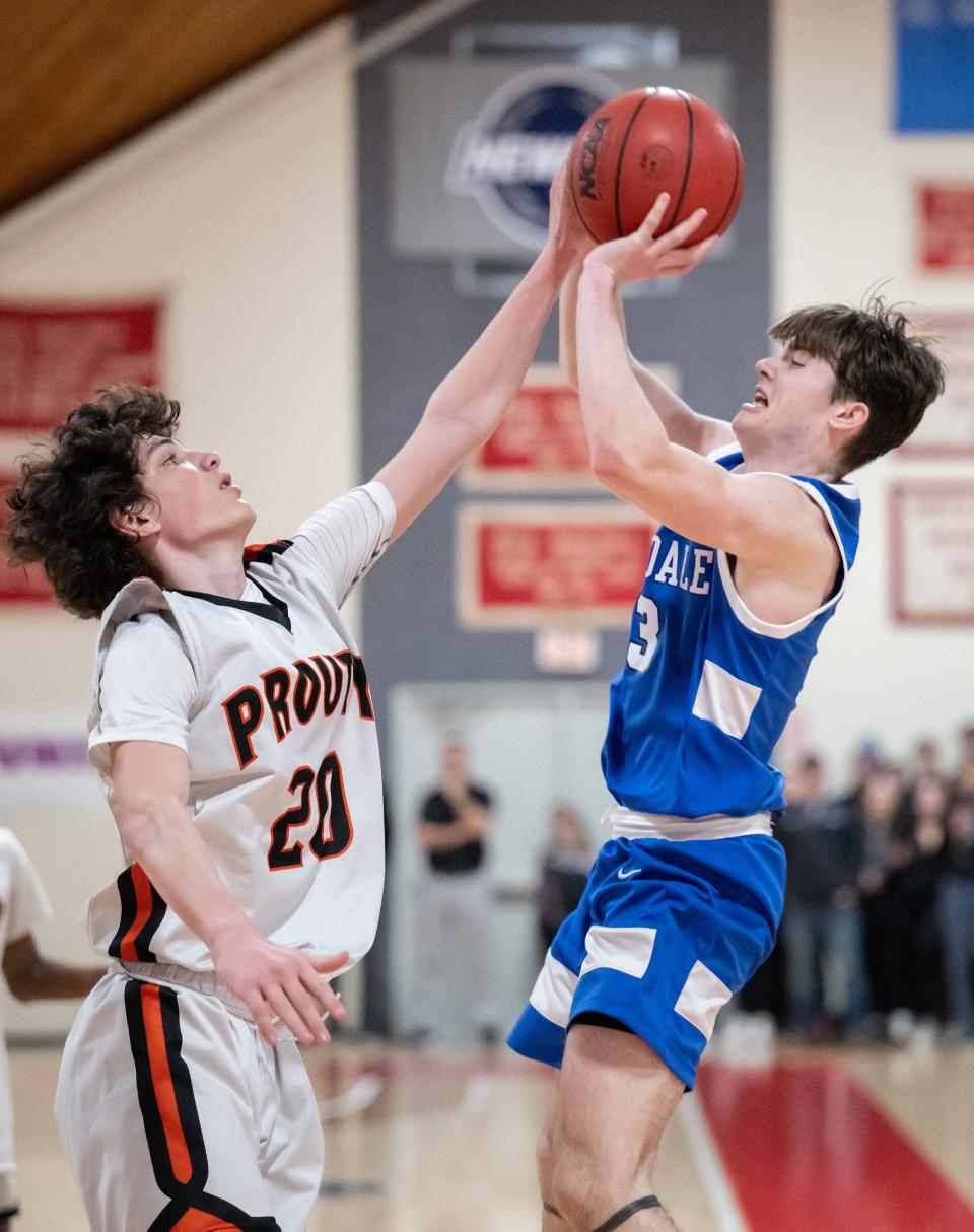 Hopedale's Patrick Madden shoots while David Prouty's Alec Fournier defends.