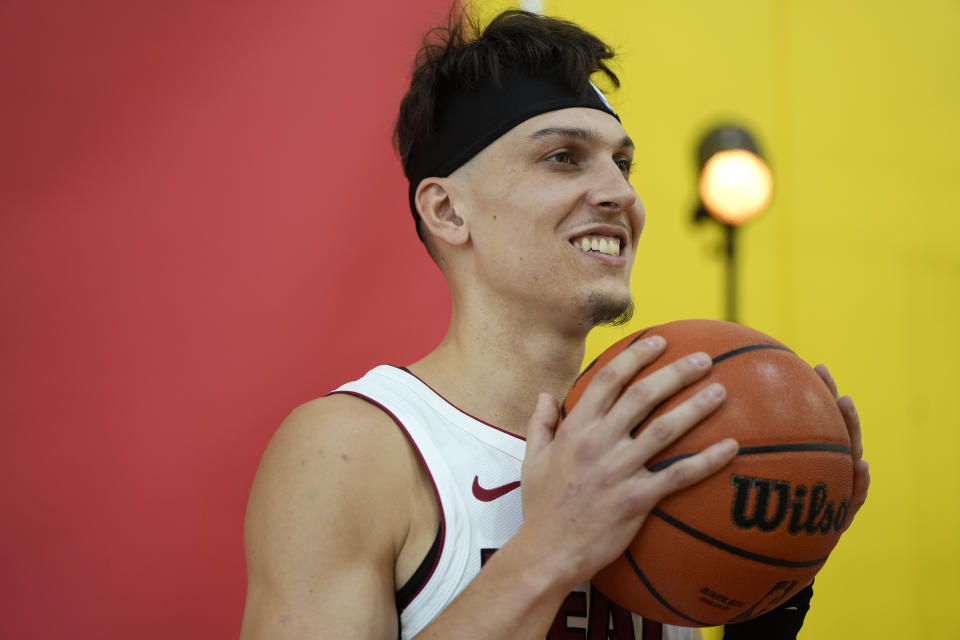 Miami Heat guard Tyler Herro (14) poses for a photographer during the NBA basketball team's media day, in Miami, Monday, Oct. 2, 2023. (AP Photo/Rebecca Blackwell)