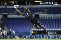 Iowa defensive back Michael Ojemudia runs a drill at the NFL football scouting combine in Indianapolis, Sunday, March 1, 2020. (AP Photo/Michael Conroy)