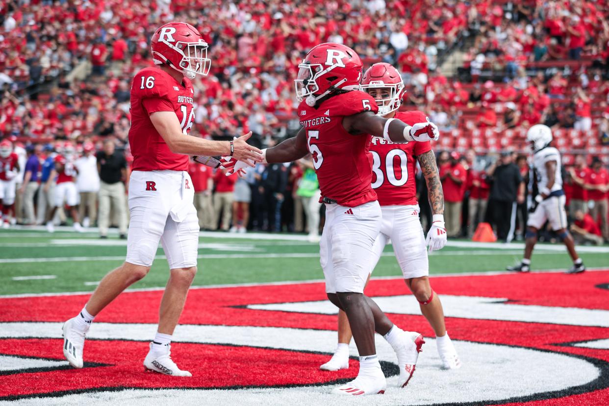 Rutgers football quarterback Athan Kaliakmanis celebrates with running back Kyle Monangai during the Scarlet Knights' game against Akron at SHI Stadium on Sept. 7, 2024.