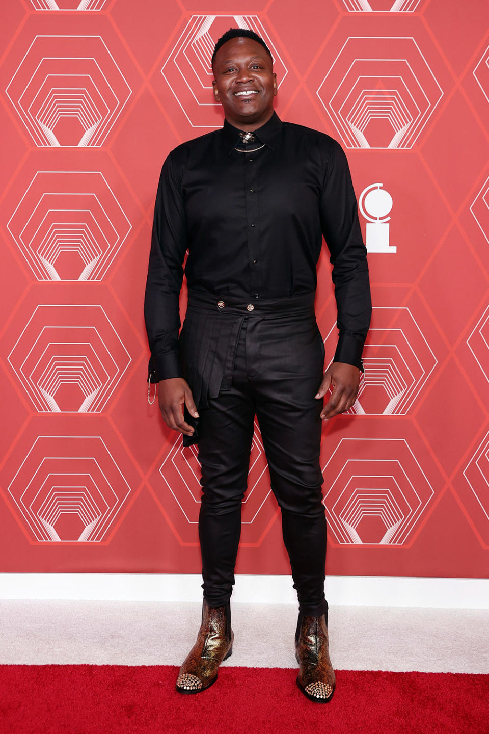 <p>Tituss Burgess wore a black ensemble to the Tony Awards, accessorizing with gold boots. </p>