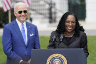 FILE - President Joe Biden listens as Judge Ketanji Brown Jackson speaks during an event on the South Lawn of the White House in Washington, April 8, 2022, celebrating the confirmation of Jackson as the first Black woman to reach the Supreme Court. The first Black woman confirmed for the Supreme Court, Jackson, is officially becoming a justice. Jackson will be sworn as the court’s 116th justice at midday Thursday, June 30, just as the man she is replacing, Justice Stephen Breyer, retires. (AP Photo/Andrew Harnik, File)