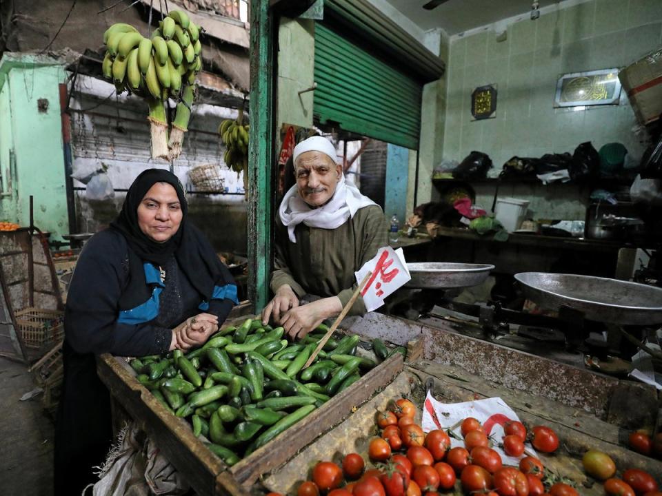 Hayes Mehana (R), 78, and Om Hany, 60, pose for a photograph at a vegetable market in Cairo, Egypt, February 12, 2018. The couple have been married for 42 years and have 12 children. Their love started at a vegetable market and now they dedicate their time to their 50-year-old vegetable shop business which they both worked to expand. 