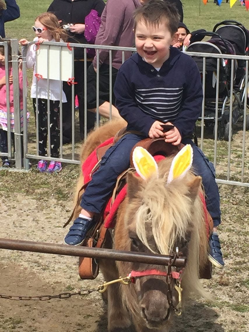 A child rides a pony at last year's Easter Eggstravganza at New Life Church in Petersburg.