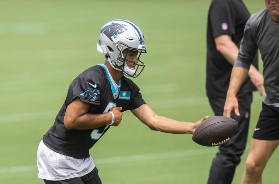 Carolina Panthers Bryce Young hands off the ball during practice in Charlotte, N.C., on Monday, August 14, 2023.