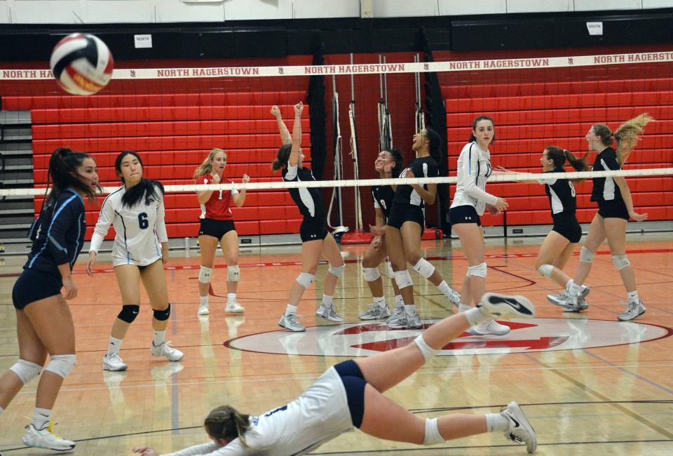 From left, North Hagerstown's Marley Knight (1), Aubrey Chamberlin, Gabby Grantham-Medley (9), Armani Kenney (10), Sophia Williams (8) and Emily Gassaway celebrate winning a point against River Hill in the first set of a Maryland Class 3A volleyball quarterfinal at North on Nov. 11, 2022.