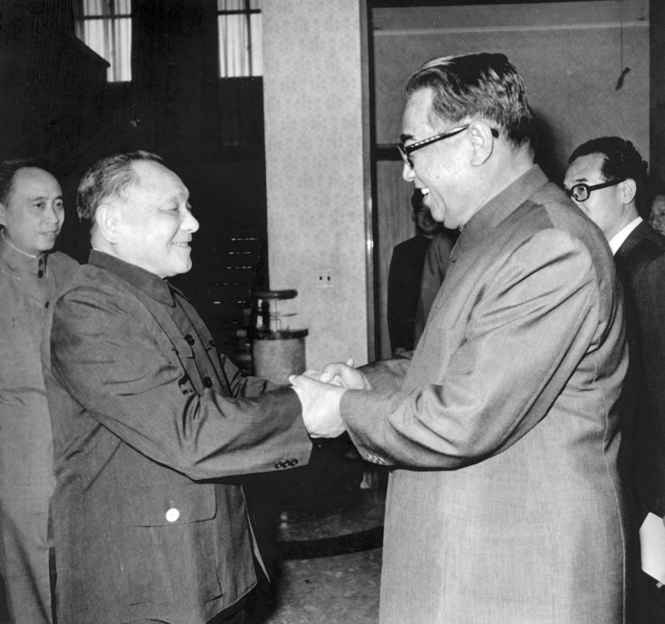 FILE - In this Sept. 17, 1982, file photo from North Korea's official Korean Central News Agency, distributed by Korea News Service, then North Korean leader Kim Il Sung, right, shakes hands with Deng Xiaoping, left, then chairman of the CPC Central Advisory Commission, at the logging house in Beijing, China. In April 1982, then Chinese leader Deng traveled to North Korea to attend celebrations of Kim Il Sung’s 70th birthday. That set up a visit by Kim to China five months later for discussions on passing leadership to his son, Kim Jong Il, and to reassure Beijing that the North wouldn’t tilt toward the Soviet Union in the next generation. (Korean Central News Agency/Korea News Service via AP)