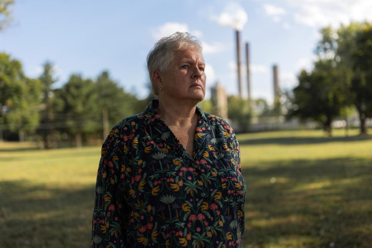 <span>Jennifer Harrison, a former resident of Cheshire, Ohio, who took the buyout from American Electric Power, revisits the land where her home used to stand on 6 September 2024.</span><span>Photograph: Maddie McGarvey/The Guardian</span>