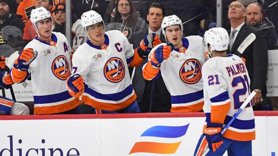 Feb 6, 2023;  Philadelphia, Pennsylvania, USA;  New York Islanders center Kyle Palmieri (21) celebrates his goal with New York Islanders center Brock Nelson (29), left wing Anders Lee (27) and center Mathew Barzal (13) against the Philadelphia Flyers during the first period at Wells Fargo Center.