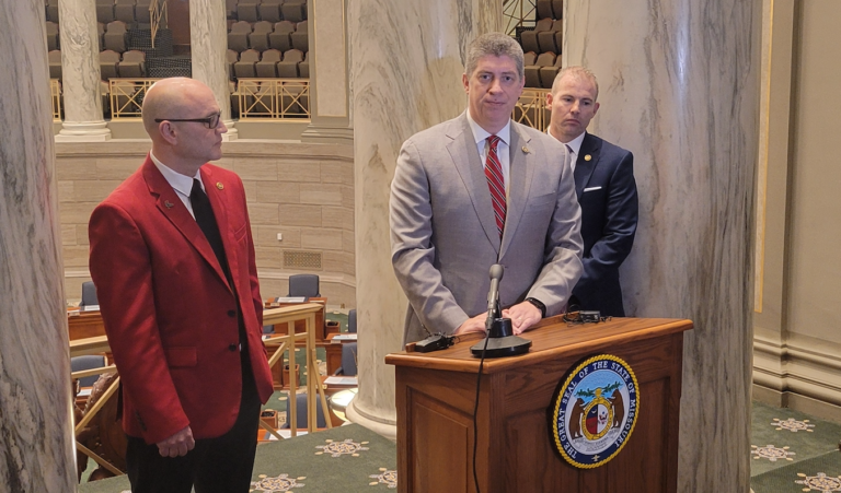 Republican Sen. Bill Eigel speaks to reporters, alongside Senate Freedom Caucus members Denny Hoskins, left, and Rick Brattin, on Jan. 23, 2024.