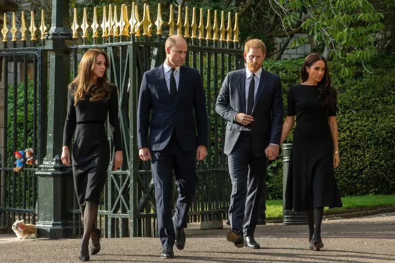Prince William and Catherine, the new Prince and Princess of Wales, accompanied by Prince Harry and Meghan, the Duke and Duchess of Sussex, arrive to view floral tributes to Queen Elizabeth II laid outside Cambridge Gate at Windsor Castle on 10th September 2022 in Windsor, United Kingdom.