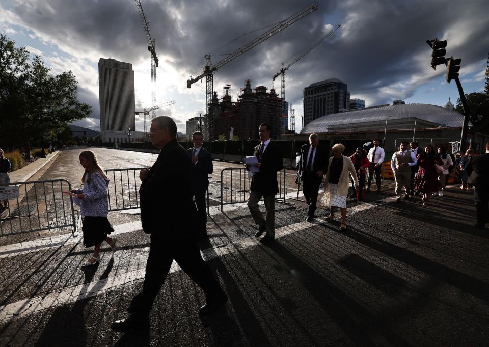 The storm clouds clear as conferencegoers walk to the Conference Center for the Sunday morning session of 193rd Semiannual General Conference of The Church of Jesus Christ of Latter-day Saints in Salt Lake City on Sunday, Oct. 1, 2023. | Jeffrey D. Allred, Deseret News