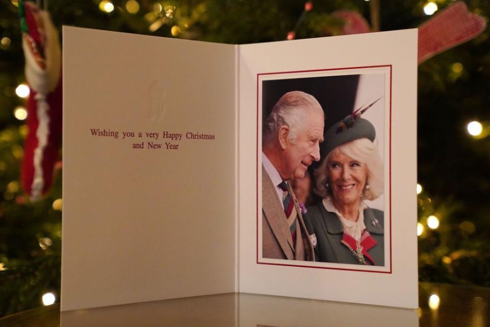 london, england december 11 the 2022 christmas card of king charles iii and the queen consort in front of a christmas tree in clarence house, london, on december 11, 2022 in london, england the photograph was taken at the braemar games on the 3rd september 2022 by samir hussein photo jonathan brady wpa poolgetty images