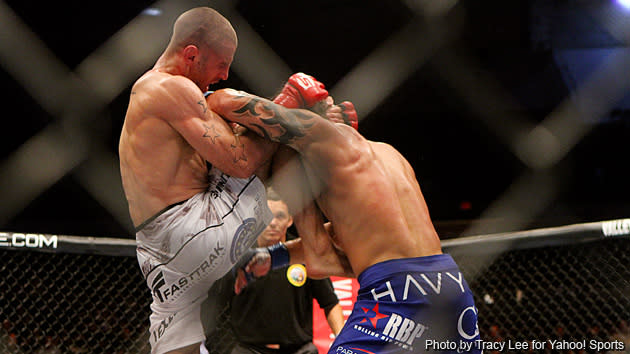 Tarec Saffiedine knees Roger Bowling during the Strikeforce event at Valley View Casino Center on August 18, 2012 in San Diego, California.