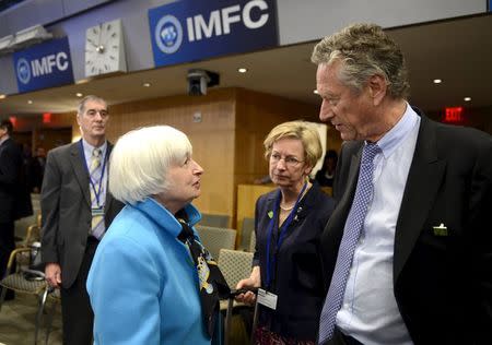 U.S. Federal Reserve Board Chair Janet Yellen (L) chats with IMF official Olivier Blanchard before the start of the International Monetary and Financial Committee (IMFC) Plenary Session, during the IMF and World Bank's 2015 Annual Spring Meetings, in Washington, April 18, 2015. REUTERS/Mike Theiler