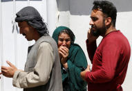 <p>Relatives of Afghan victims mourn outside a hospital after a blast in Kabul, Afghanistan May 31, 2017. (Omar Sobhani/Reuters) </p>