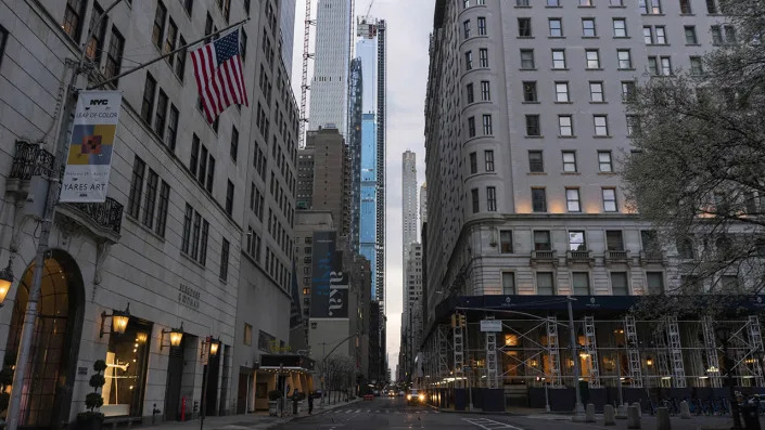 The 5th Avenue area is completely empty on Friday, March 2020 in New York, NY. The city officially announced the closure of all non-essential businesses and implemented a lockdown order earlier in the week. <span class="copyright">Photo by Erin Lefevre/NurPhoto via Getty Images</span>