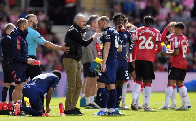 Erik ten Hag in discussion with Christian Eriksen during a drinks break at St Mary's