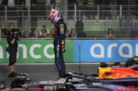 Red Bull driver Max Verstappen of the Netherlands celebrates after winning the Formula One Saudi Arabian Grand Prix at the Jeddah Corniche Circuit, in Jedda, Saudi Arabia, Saturday, March 9, 2024. (AP Photo/Darko Bandic)