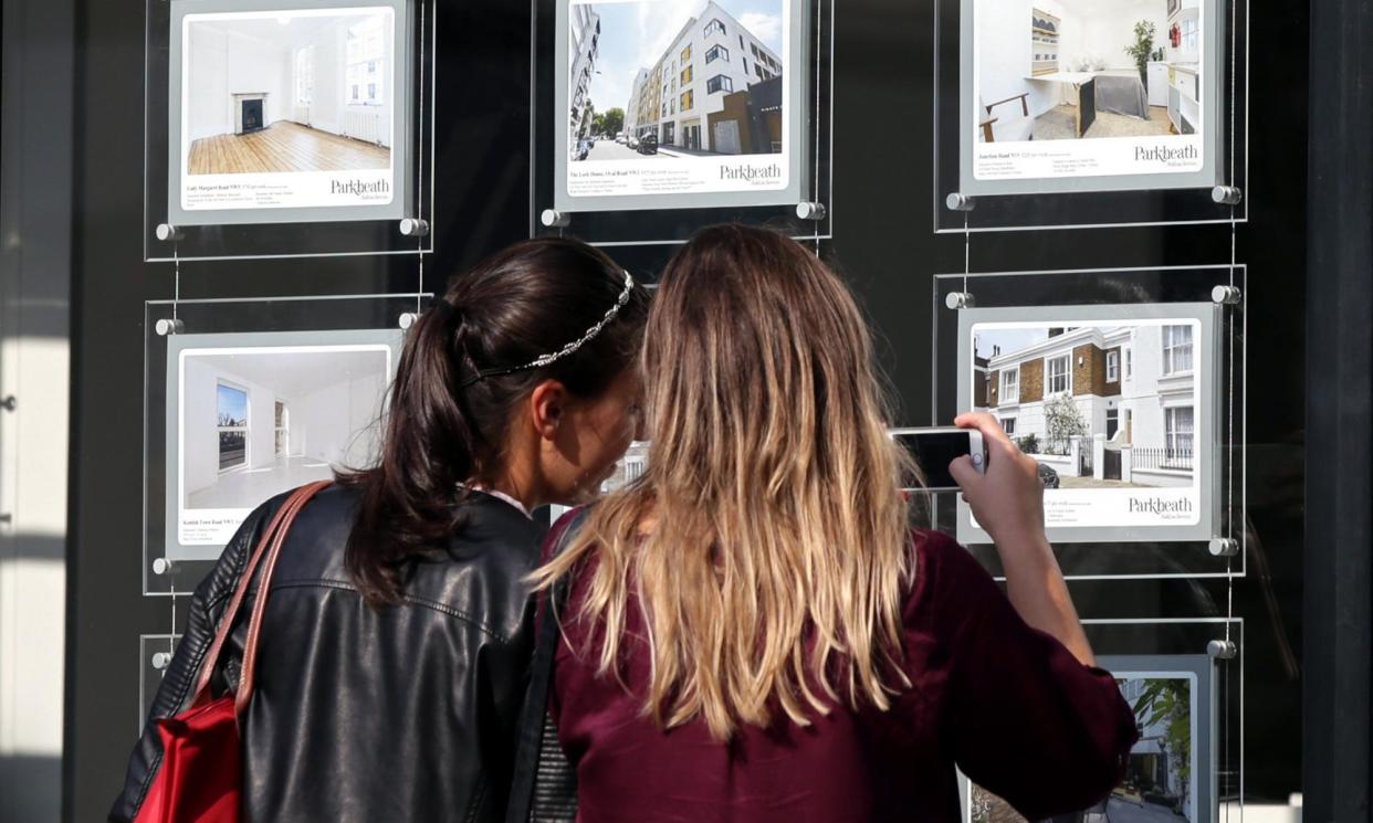 <span>Women study the house price signs in an estate agent’s window, in Kentish Town, London. </span><span>Photograph: Yui Mok/PA</span>