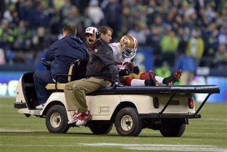 Jan 19, 2014; Seattle, WA, USA; San Francisco 49ers inside linebacker NaVorro Bowman (53) is carted off the field after an injury against the Seattle Seahawks during the second half of the 2013 NFC Championship football game at CenturyLink Field. Mandatory Credit: Kirby Lee-USA TODAY Sports