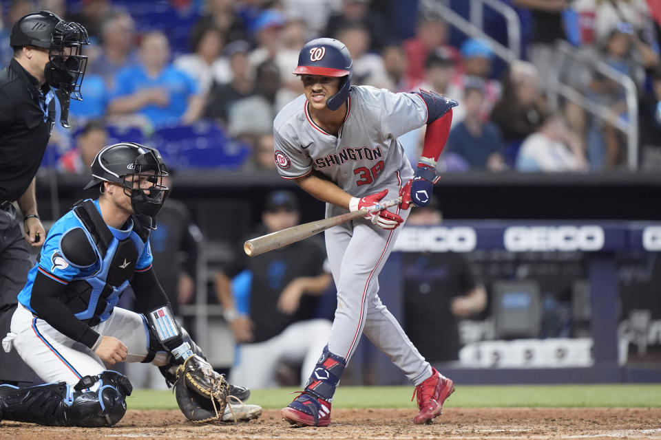 Washington Nationals' Trey Lipscomb (38) reacts after being hit by a pitch during the fifth inning of a baseball game against the Miami Marlins, Sunday, April 28, 2024, in Miami. (AP Photo/Wilfredo Lee)