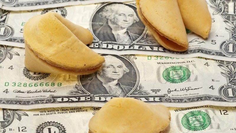 Fortune cookies on a pile of money