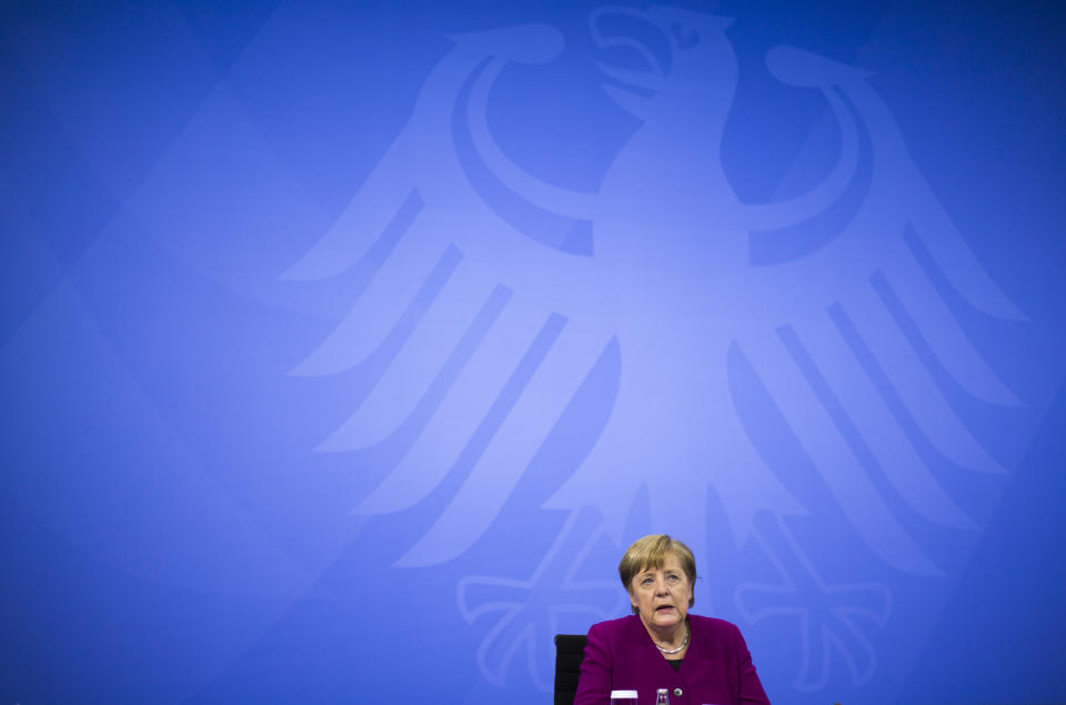 CORRECTS DAY - German Chancellor Angela Merkel attends a news conference with Bavarian state governor Markus Soeder and the Mayor of Berlin Michael Mueller after a meeting at the chancellery in Berlin, Germany, Wednesday, March 3, 2021. German Chancellor Angela Merkel conferred with the governors of the country's 16 states to discuss how to move forward with coronavirus restrictions (AP Photo/Markus Schreiber, Pool)