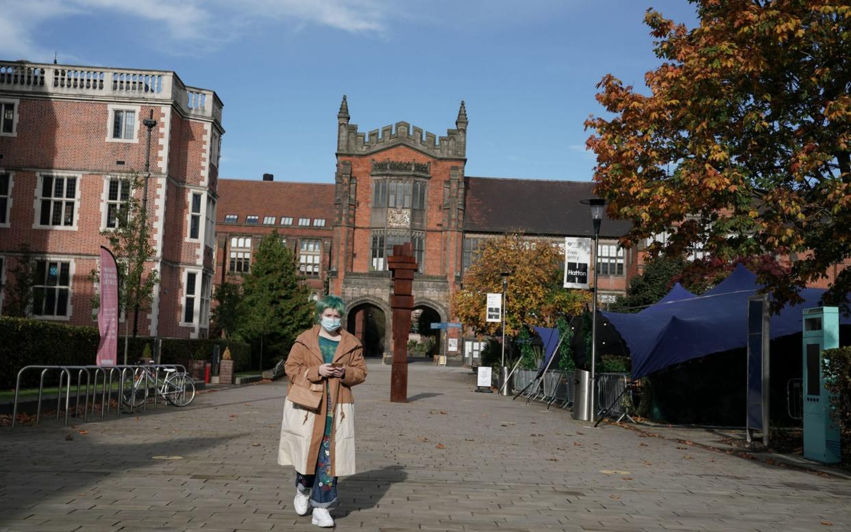 A student walks in front of the Arches at Newcastle University in Newcastle -  Owen Humphreys/PA