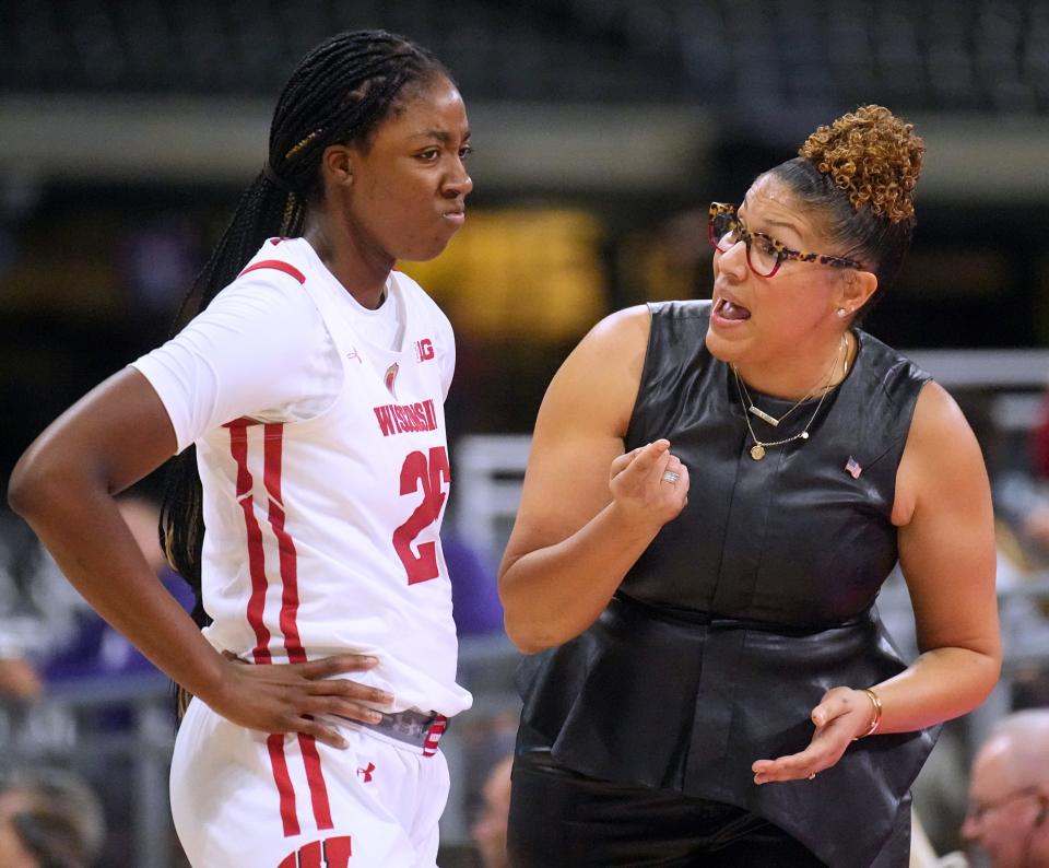 Wisconsin forward Serah Williams (25) listens to head coach Marisa Moseley during the second half of their game against Kansas State Friday, November 11, 2022 at American Family Field in Milwaukee, Wis.