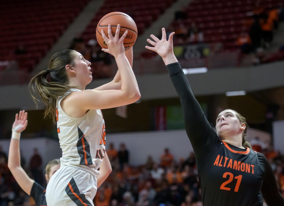 Illini Bluffs' Lily Luczkowiak, left, shoots over Altamont's Kaylee Lurkins in the second half of their Class 1A girls basketball state semifinal Thursday, Feb. 29, 2024 at CEFCU Arena in Normal. The Tigers defeated the Lady Indians 60-48 in overtime.