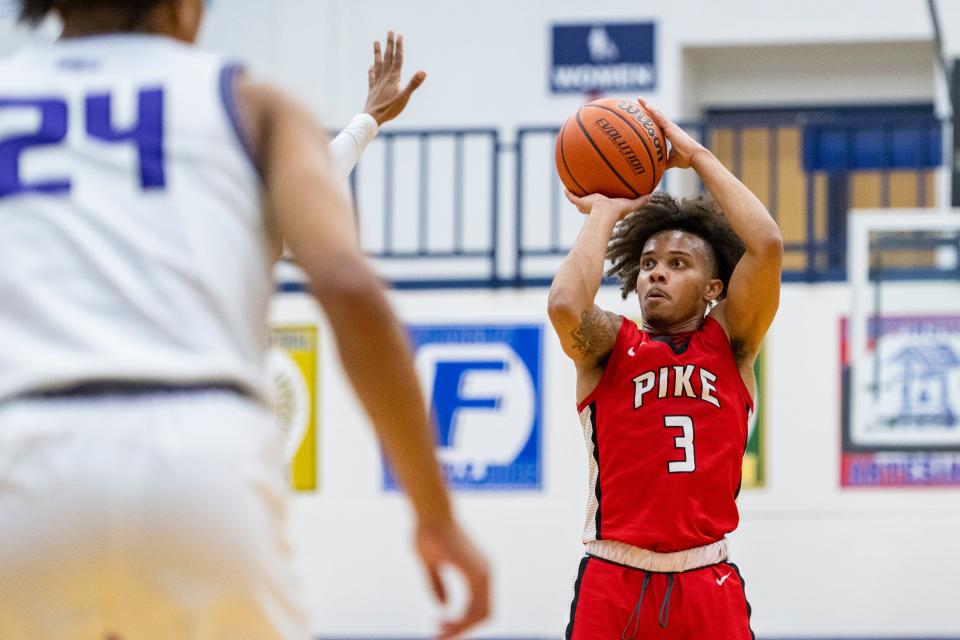 Pike High School senior Devon Woods (3) shoots during the first half of an IHSAA Sectional basketball game against Ben Davis High School, Saturday, March 4, 2023, at Perry Meridian High School.