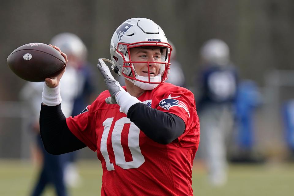 New England Patriots quarterback Mac Jones (10) throws a pass during an NFL football practice, Wednesday, Dec.15, 2021, in Foxborough, Mass. (AP Photo/Steven Senne)