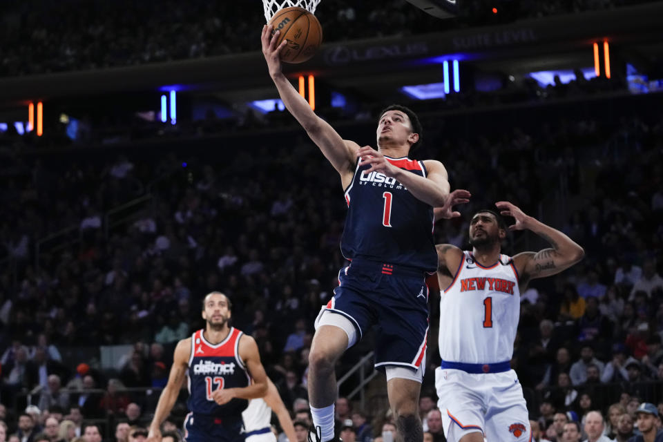 Washington Wizards' Johnny Davis (1) drives past New York Knicks' Obi Toppin (1) during the second half of an NBA basketball game Sunday, April 2, 2023, in New York. The Knicks won 118-109. (AP Photo/Frank Franklin II)