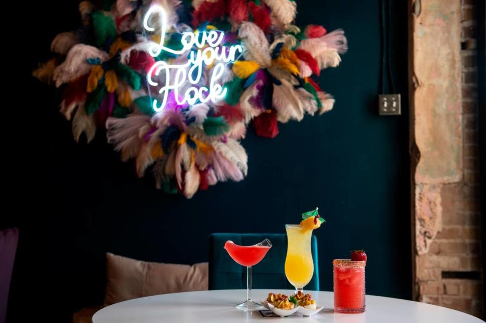 Three speciality cocktails, The Shake Ya Tail Feather, left, the Fire Bird Margarita, right, and the Bird of Paradise, and the hot honey bacon deviled eggs at the Hen House, which serves drinks and small bites, in Bay St. Louis on Wednesday, May 29, 2024.