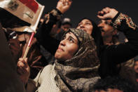 FILE - In this Feb. 11, 2011 file photo, an Egyptian woman cries as she celebrates the news of the resignation of President Hosni Mubarak, who handed control of the country to the military, in Tahrir Square, Cairo, Egypt. A decade later, thousands are estimated to have fled abroad to escape a state, headed by President Abdel Fattah el-Sissi, that is even more oppressive. (AP Photo/Tara Todras-Whitehill, File)