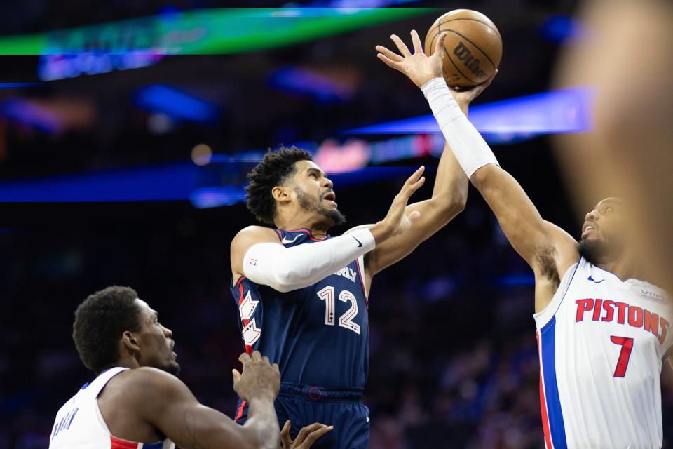 76ers forward Tobias Harris drives for a shot against Pistons forward Troy Brown Jr. during the first quarter on Tuesday, April 9, 2024, in Philadelphia.